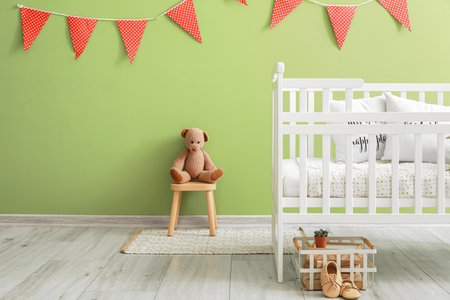 Children room with modern crib near color wallの写真素材