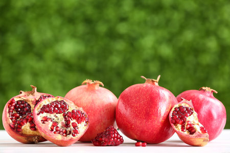 Fresh pomegranates on table outdoorsの写真素材