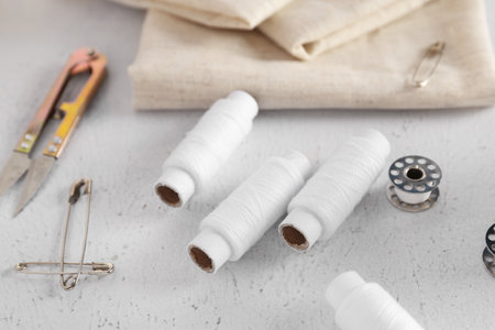 Different sewing supplies on light backgroundの写真素材