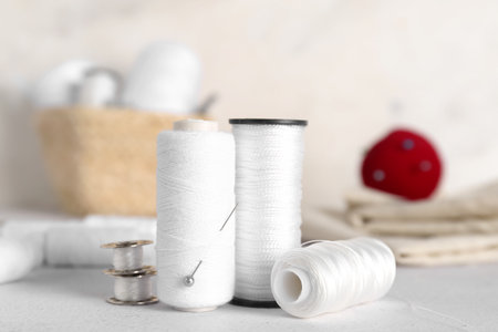 Thread spools on light tableの写真素材