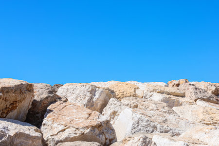 View of natural stones against blue sky