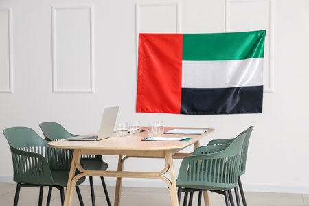 Interior of modern meeting room with laptop and flag of UAEの写真素材