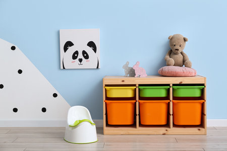 Potty and drawers near color wallの写真素材