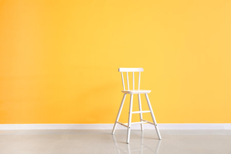 modern chair near yellow wallの写真素材