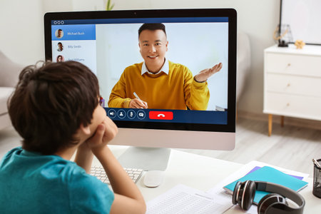 Little boy studying online at homeの写真素材