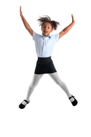 Jumping African-American schoolgirl on white backgroundの写真素材