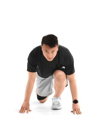 Sporty male runner on white background