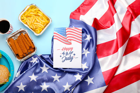 Greeting card for Independence Day with traditional food and American flag on color backgroundの写真素材