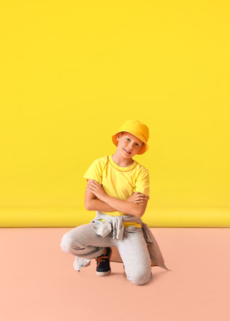 Cool little boy on color backgroundの写真素材