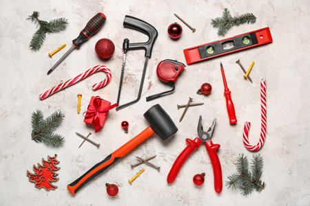 Worker's tools, Christmas decor and gift on grunge backgroundの写真素材
