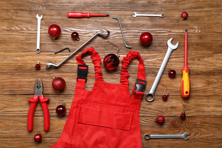 Plumber's supplies with Christmas balls on wooden backgroundの写真素材