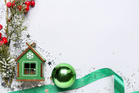 Composition with beautiful Christmas decorations and sequins on light backgroundの写真素材