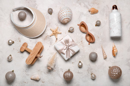 Travel accessories with Christmas decor and seashells on grunge backgroundの写真素材