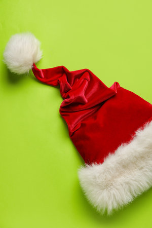 Santa hat on green background, closeupの写真素材