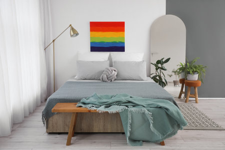 Interior of modern bedroom with rainbow painting and mirrorの写真素材