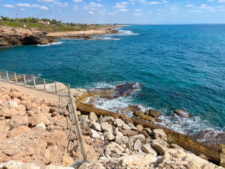 Beautiful sea view with fenced rocky shoreの写真素材