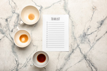 Blank to do list and dirty empty cups on light background