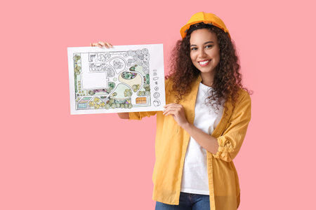 Young female landscape designer with new project on color backgroundの写真素材