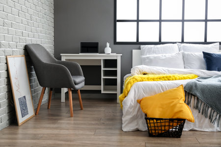 Interior of modern bedroom with workplaceの写真素材