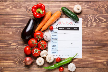 Healthy products with meal plan on wooden backgroundの写真素材