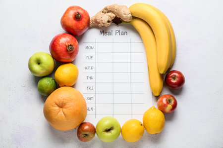 Meal plan with fresh fruits on white backgroundの写真素材
