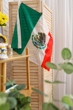 Mexican flag on folding screen in living roomの写真素材