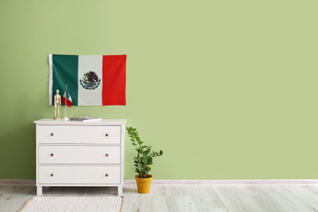 Stylish interior with Mexican flag near green wallの写真素材