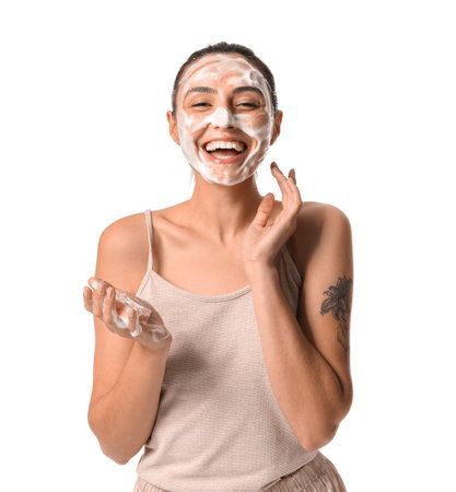 Beautiful young woman with soap on white backgroundの写真素材