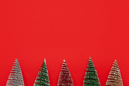 Decorative Christmas tree on red backgroundの写真素材