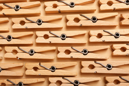 Wooden clothes pins as background, closeup