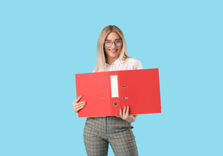 Pretty young woman with red folder on blue background
