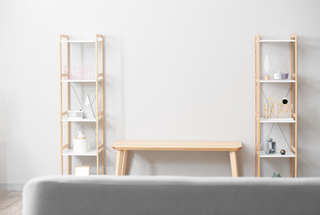 Interior of light living room with TV stand and shelving unitsの写真素材