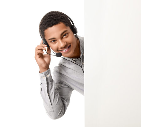 African-American technical support agent with blank poster on white background