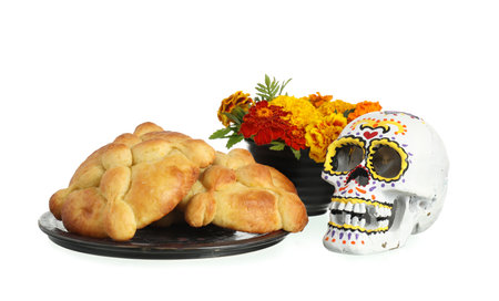 Bread of the dead and painted skull on white background. Celebration of Mexico's Day of the Dead (El Dia de Muertos)の写真素材