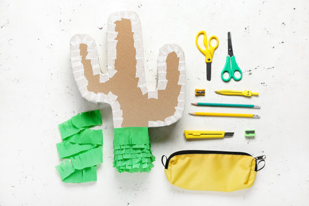 Preparation of Mexican pinata on light background