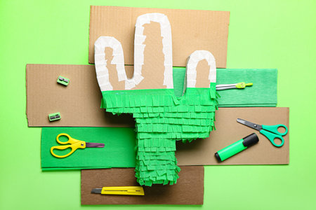 Preparation of Mexican pinata on color backgroundの写真素材