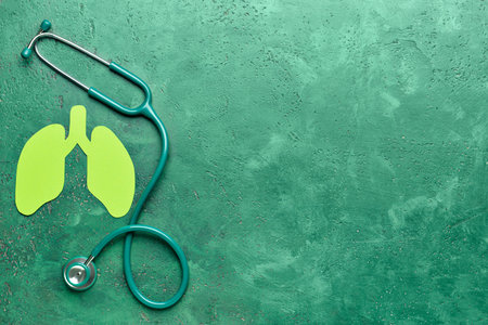 Paper lungs with stethoscope on grunge backgroundの写真素材