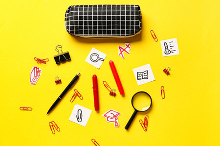 Pencil case and stationery on color background
