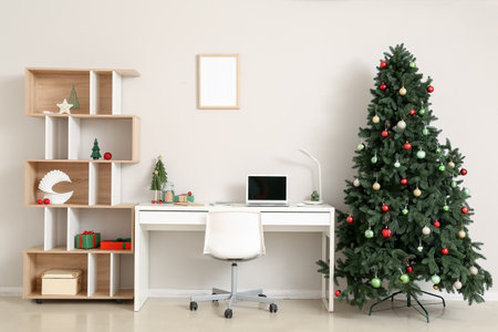 Interior of office with workplace, Christmas trees and presentsの写真素材