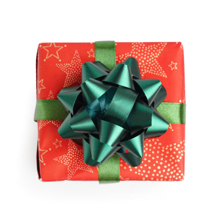 Christmas gift box with green bow on white background
