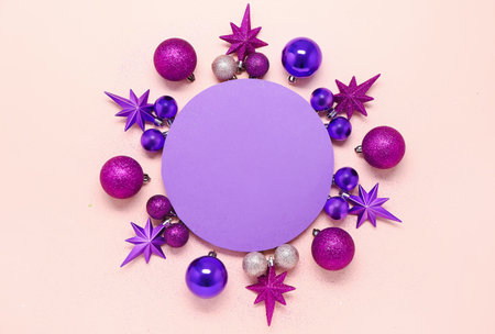 Composition with blank card and colorful Christmas decorations on color backgroundの写真素材