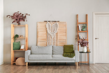 Interior of living room with vases and blossoming branches