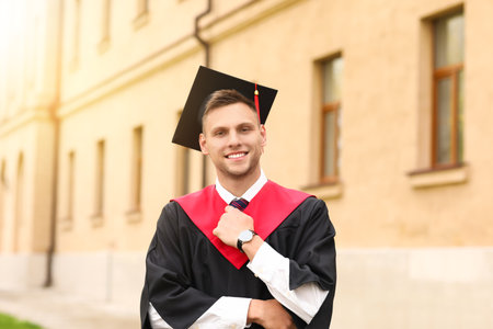 Portrait of male graduating student outdoorsの写真素材