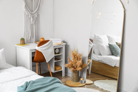 Modern interior of light bedroom with mirrorの写真素材