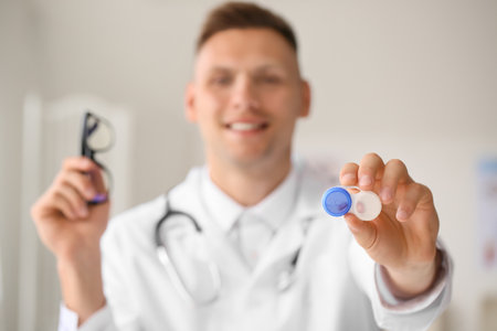 Ophthalmologist with contact lenses in clinicの写真素材
