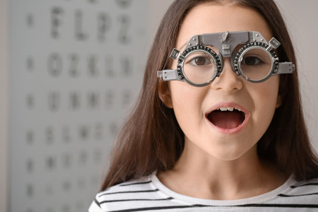 Little girl undergoing eye test in clinicの写真素材