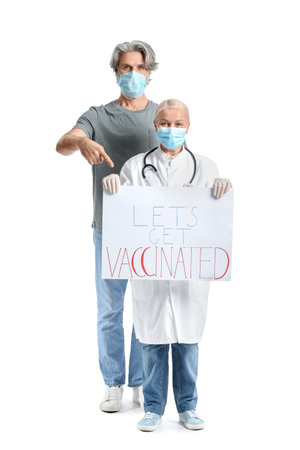 Doctor and patient holding poster with text LET'S GET VACCINATED on white backgroundの写真素材