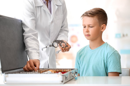 Little boy undergoing eye test in clinicの写真素材