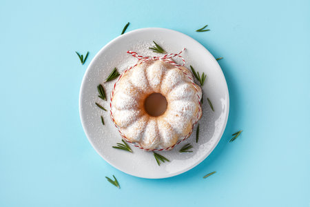 Plate with tasty Christmas cake on color background