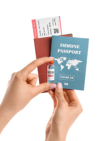 Hands with immune passport, vaccine and documents on white backgroundの写真素材